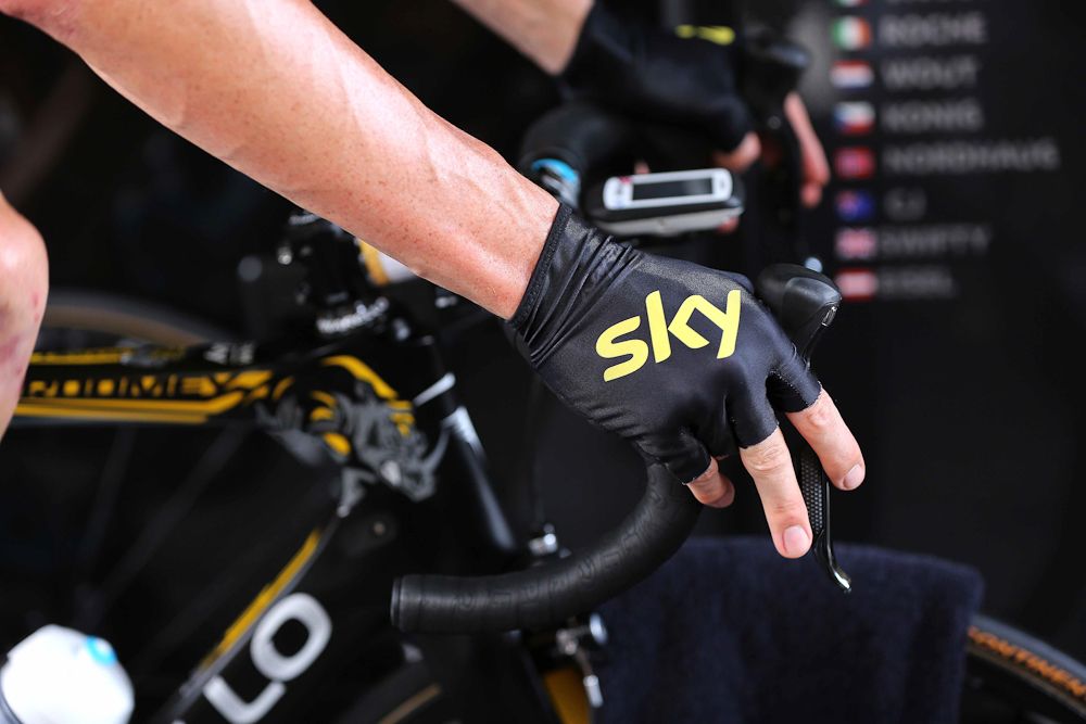 Gold-trimmed gloves for race leader Chris Froome.