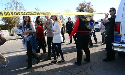 Survivors being evacuated from the scene of the shooting