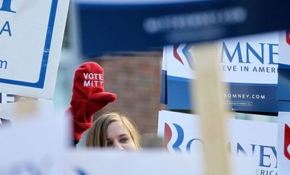 A Romney supporter rallies in New Hampshire on Tuesday: Mitt leads by double digits in the final polls, but skeptics warn that anything can happen in the unpredictable Granite State.