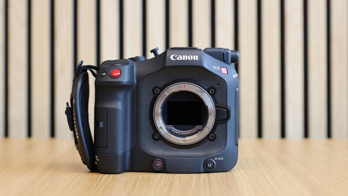 Canon EOS C80 cinema camera on wooden desk with wooden paneling behind