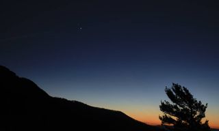 Saturn, top, and Jupiter, below, are seen after sunset from Shenandoah National Park, Sunday, Dec. 13, 2020, in Luray, Virginia.