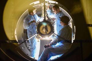 ZTF team members install the 605-megapixel wide-field camera at the prime focus of the 48-inch Samuel Oschin Telescope at Palomar Observatory in California.