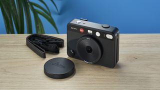 A black Leica Sofort 2 hybrid instant camera