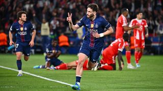 Kvicha Kvaratskelia raises two fingers to mark his brace in the first leg of the Champoins League 2025/26 semifinal first leg win for PSG against Bayern Munich.