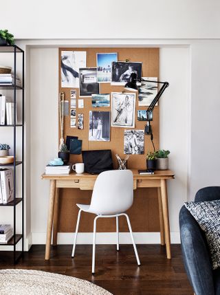 Home office with cork board in a living room
