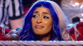 Zelina Vega crying while being introduced for her match against Rhea Ripley.