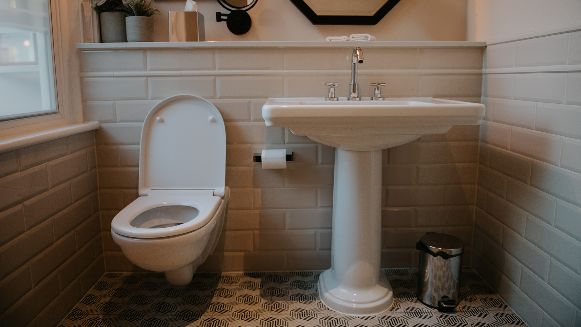 Sink and toilet in bathroom