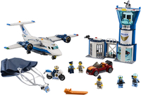 Build a 3-level Sky Police airbase with control tower, jail cell with a breakaway wall, large police plane, jetpack with foldable wings, working parachute, and a getaway car for exciting police chase action.