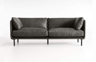 A contemporary dark gray leather sofa
