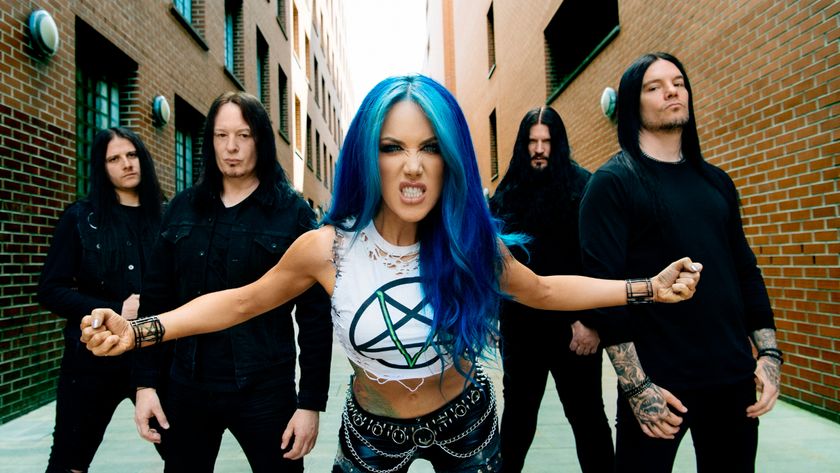 Arch Enemy posing in an alleyway