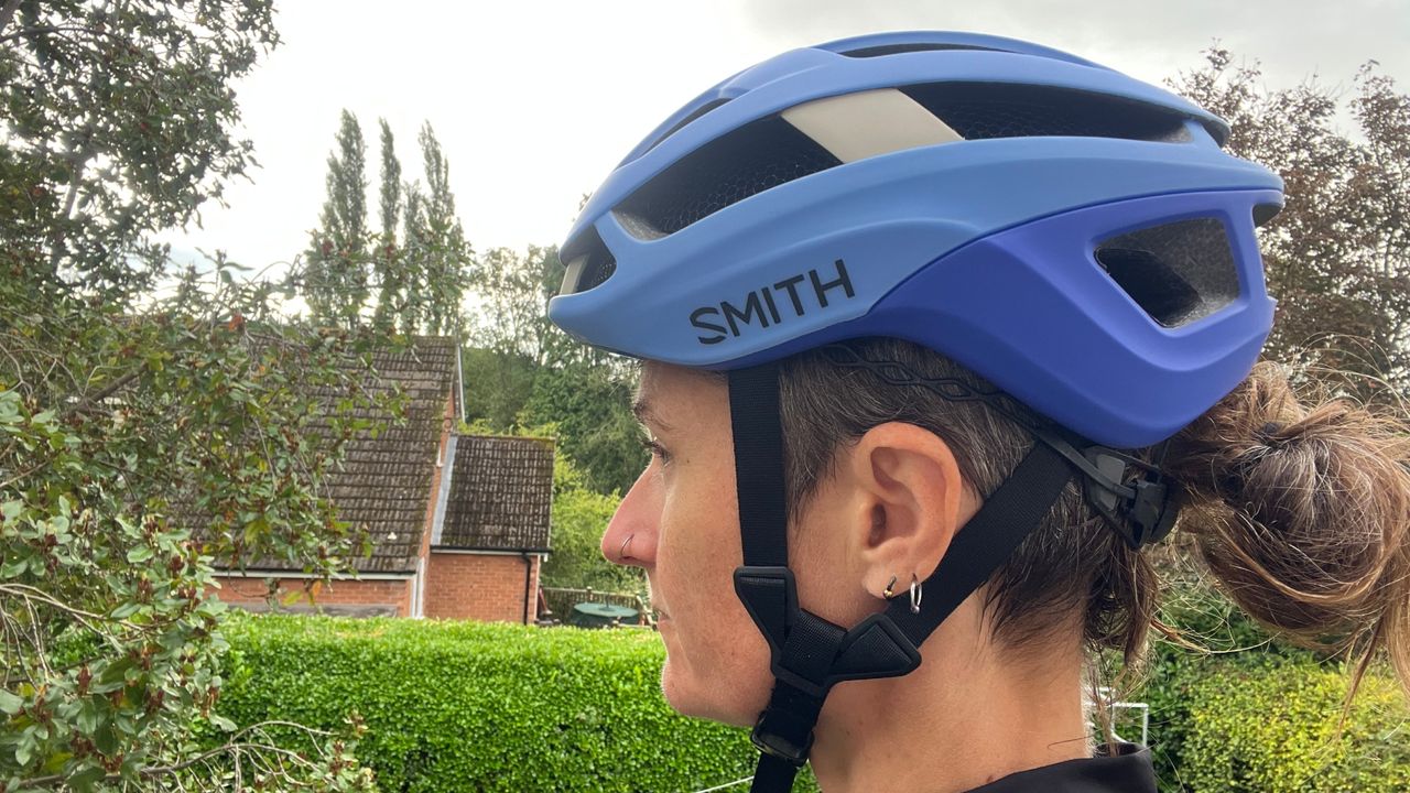 The blue Smith Optics Trace MIPS helmet being worn on a women&#039;s head