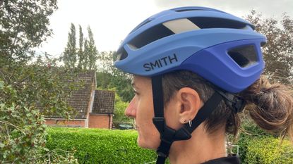 The blue Smith Optics Trace MIPS helmet being worn on a women's head