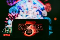 Stranger Things logo shown on a smartphone