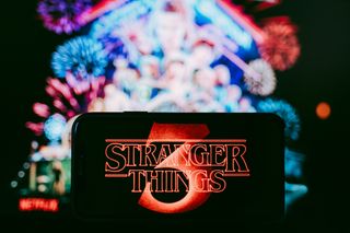 Stranger Things logo shown on a smartphone