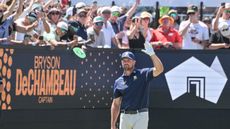 Bryson DeChambeau waves to the crowd