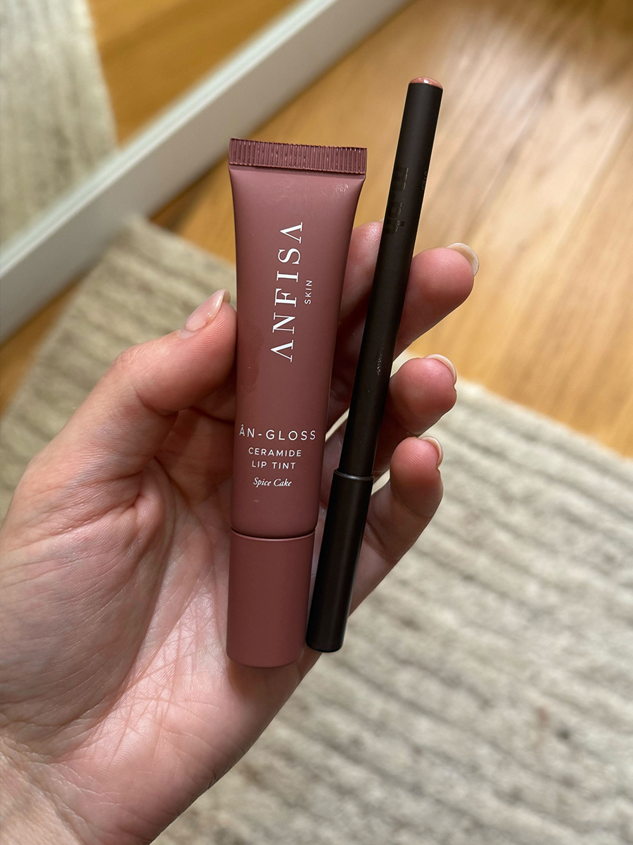 Senior Beauty Editor Jamie Schneider holding the Anifsa Skin &amp;Acirc;n-Gloss Ceramide Lip Tint and m.ph Overliner Lip Liner Pencil