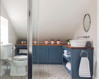 Charlotte Gooch Bathroom with dark blue bathroom cabinetry