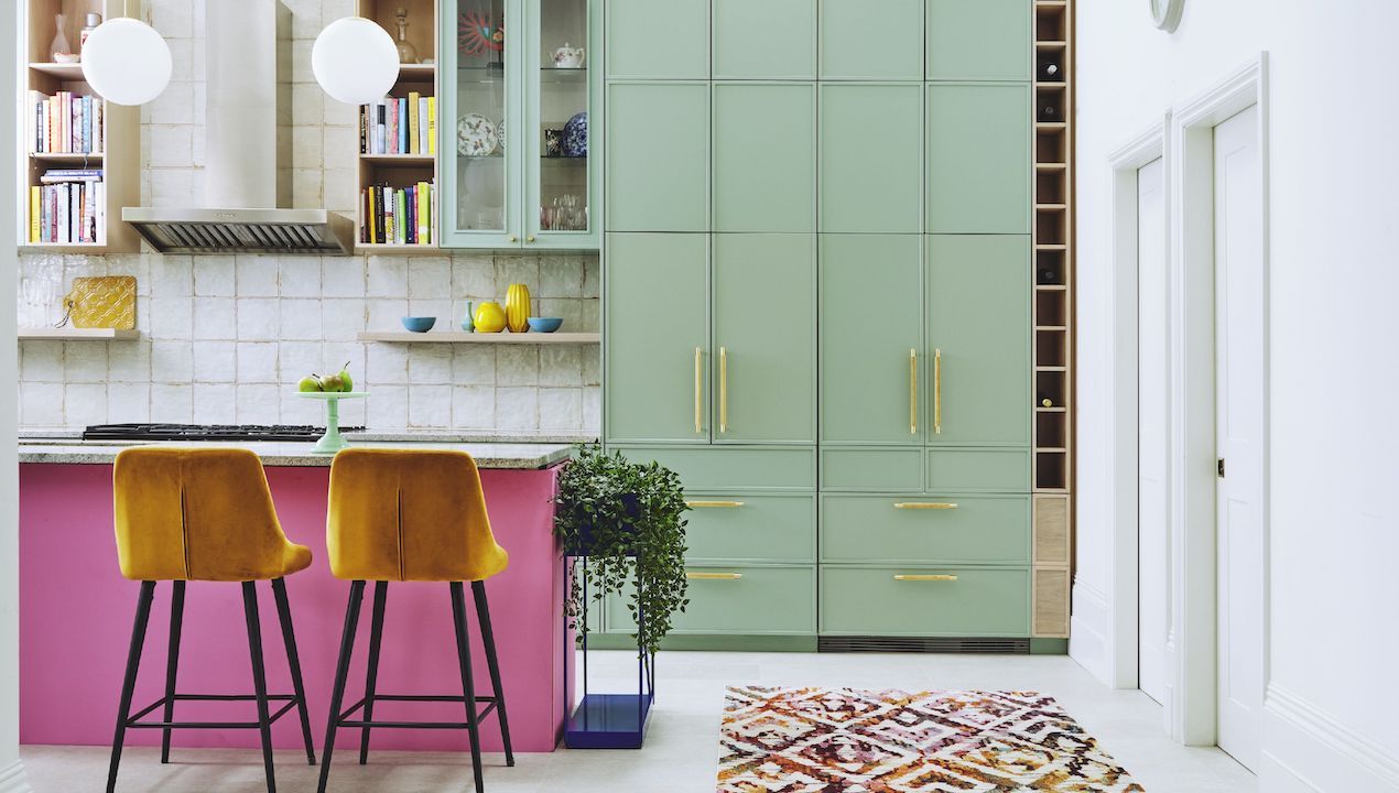 kitchen in pink and green with gold velvet bar stools