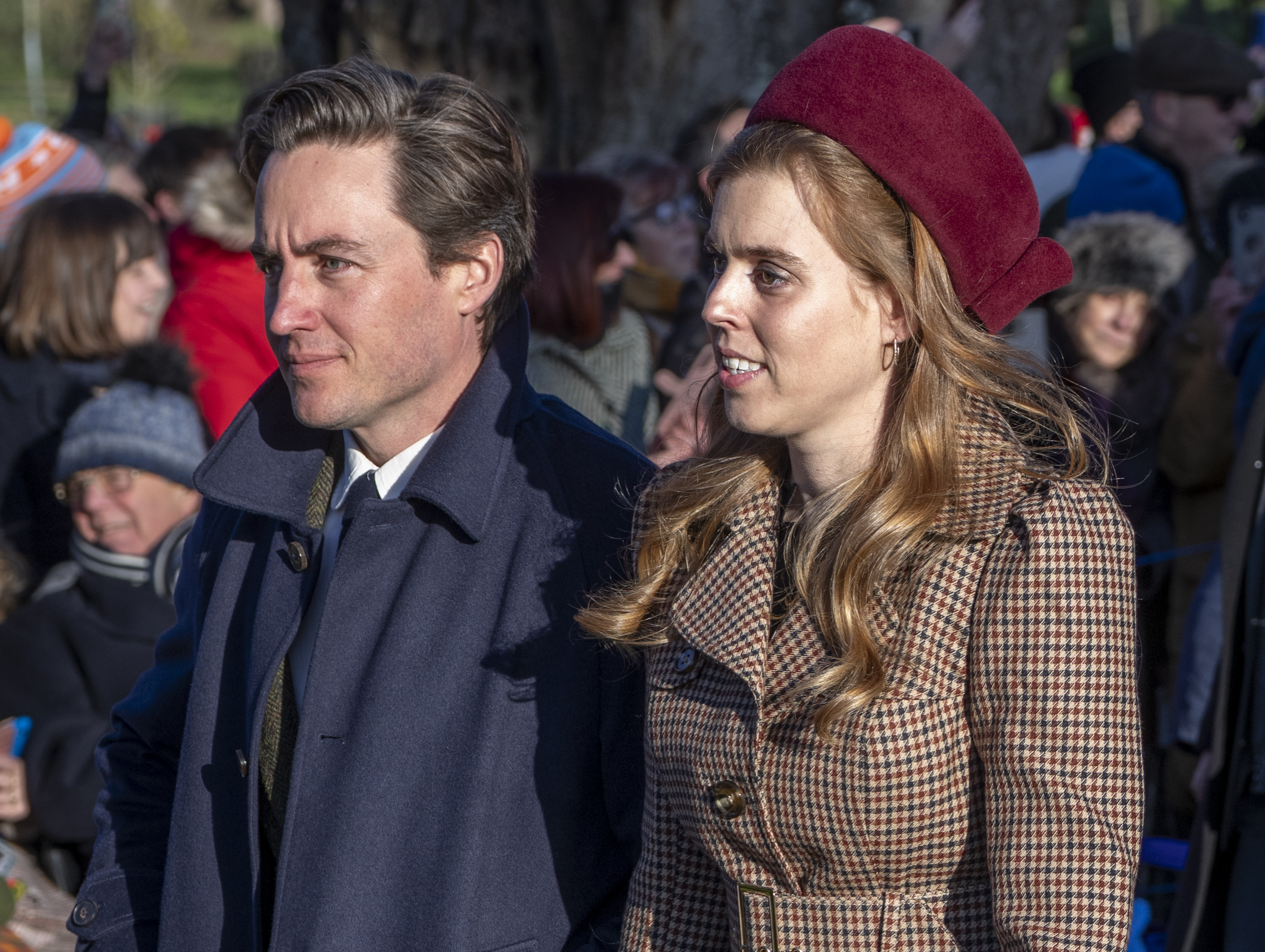 Princess Beatrice wearing a checked coat and maroon hat walking with Edoardo Mapelli Mozzi on Christmas morning 2025