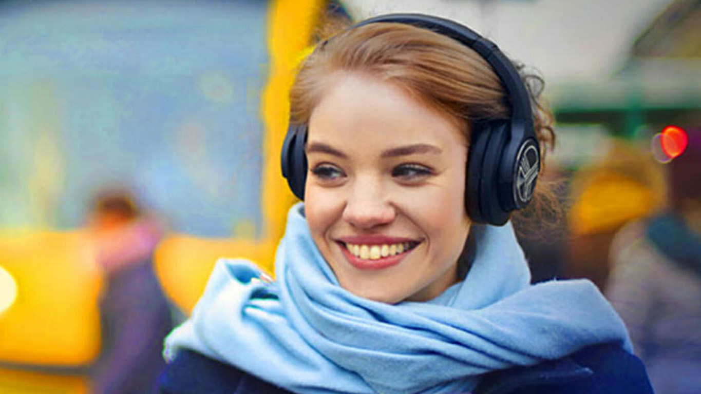 Woman wearing Treblab Z2 headphones.