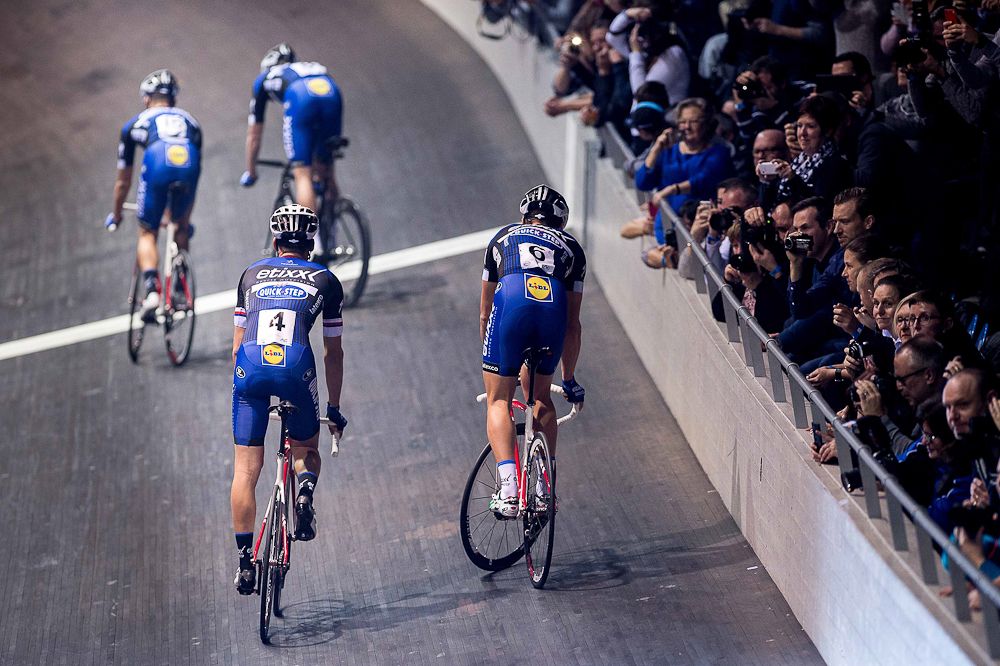 Riders test their track-stand skills at the Etixx-QuickStep team presentation.