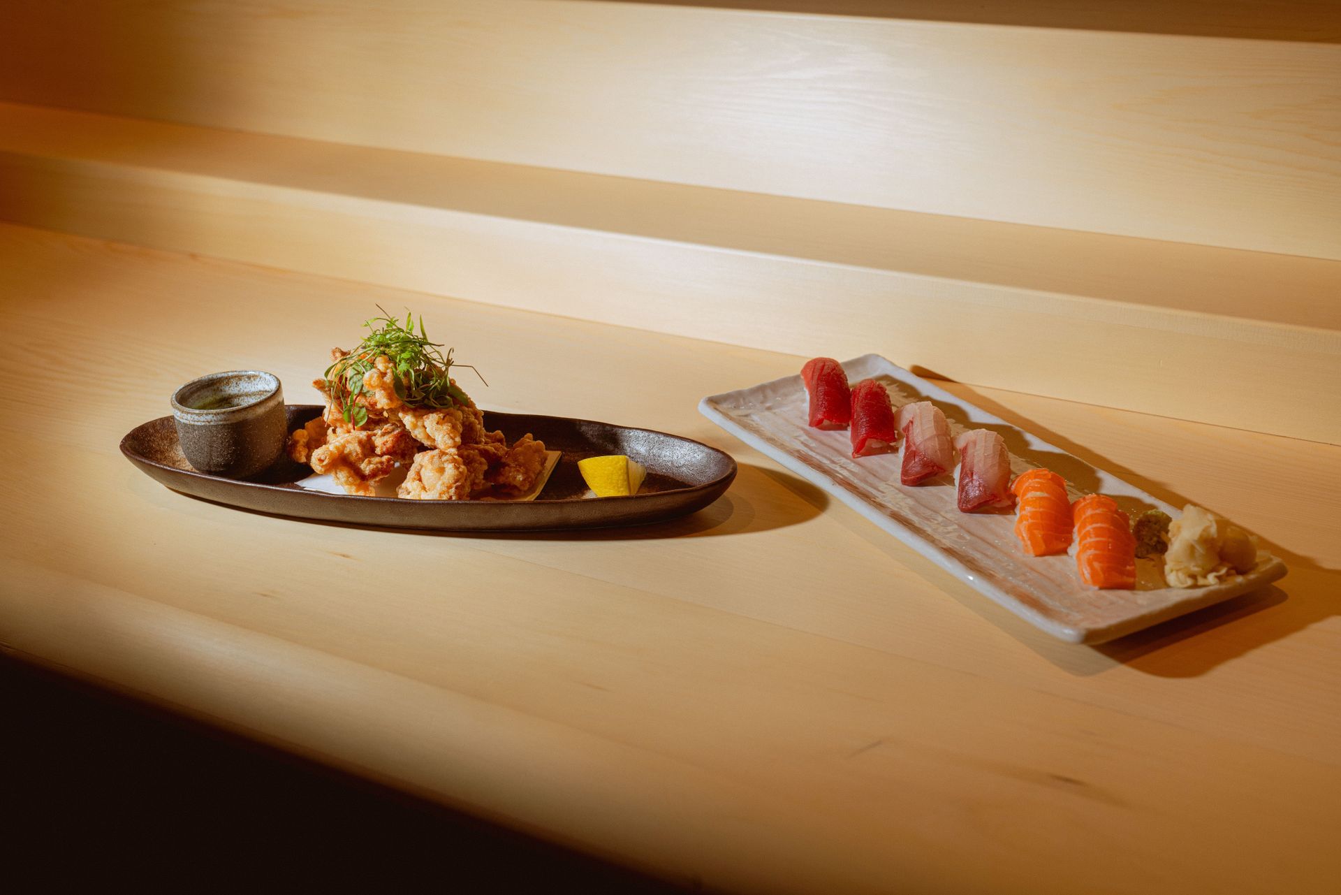 Iné two dishes off the menu, including eight pieces of sushi