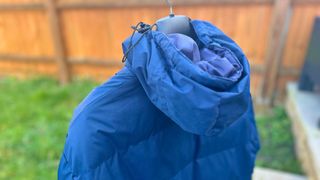 A waterproof jacket drying outside after being washed