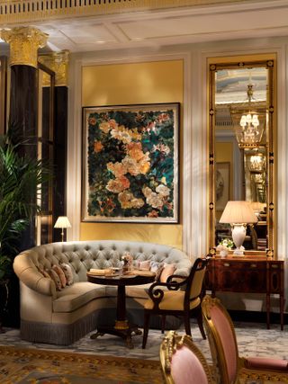 The Promenade at the Dorchester with paintings and pastel seats