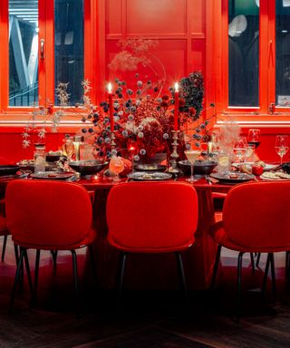 Red color drenched dining room