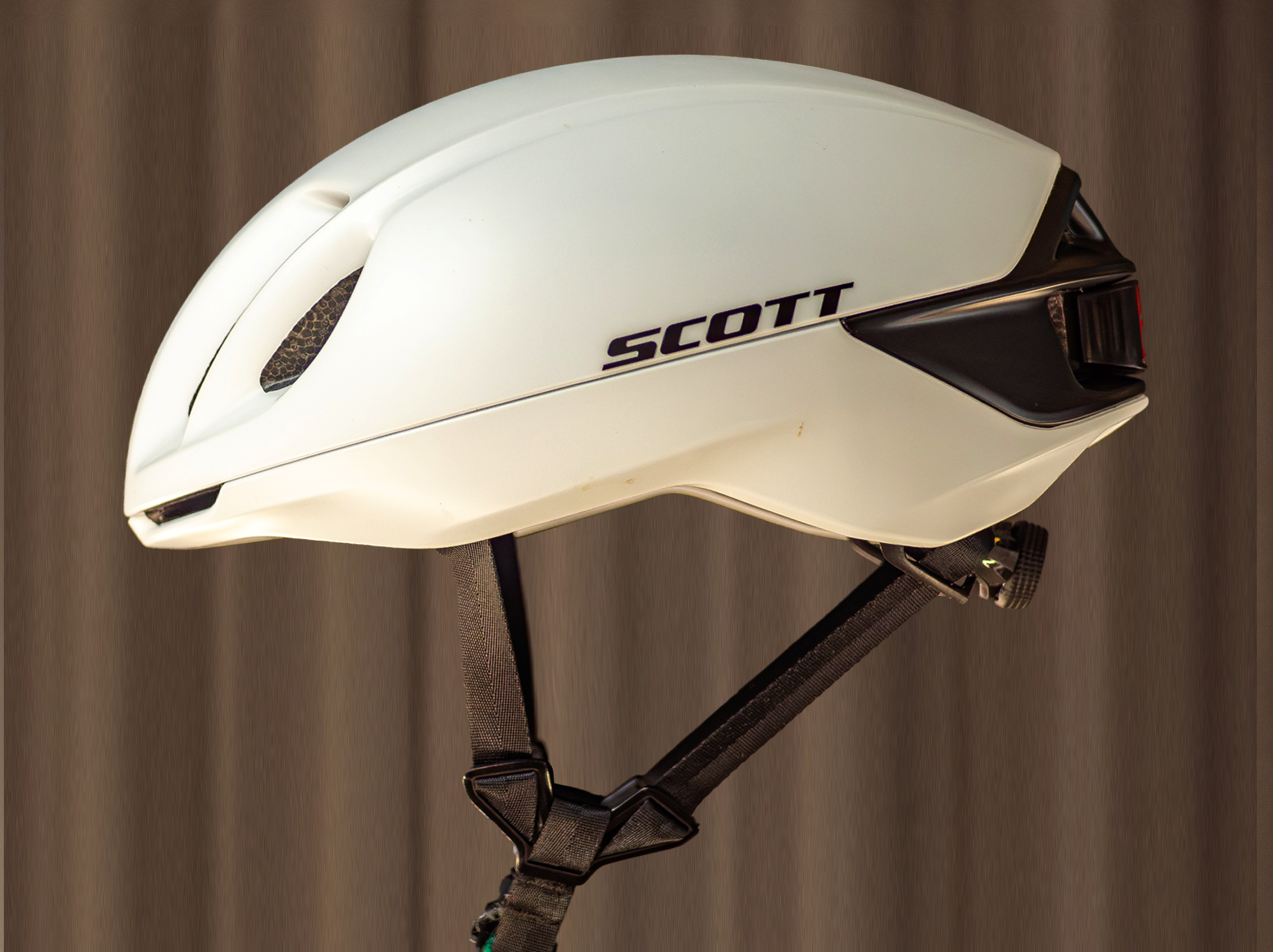 A white Scott Cadence Plus Helmet on a plain background