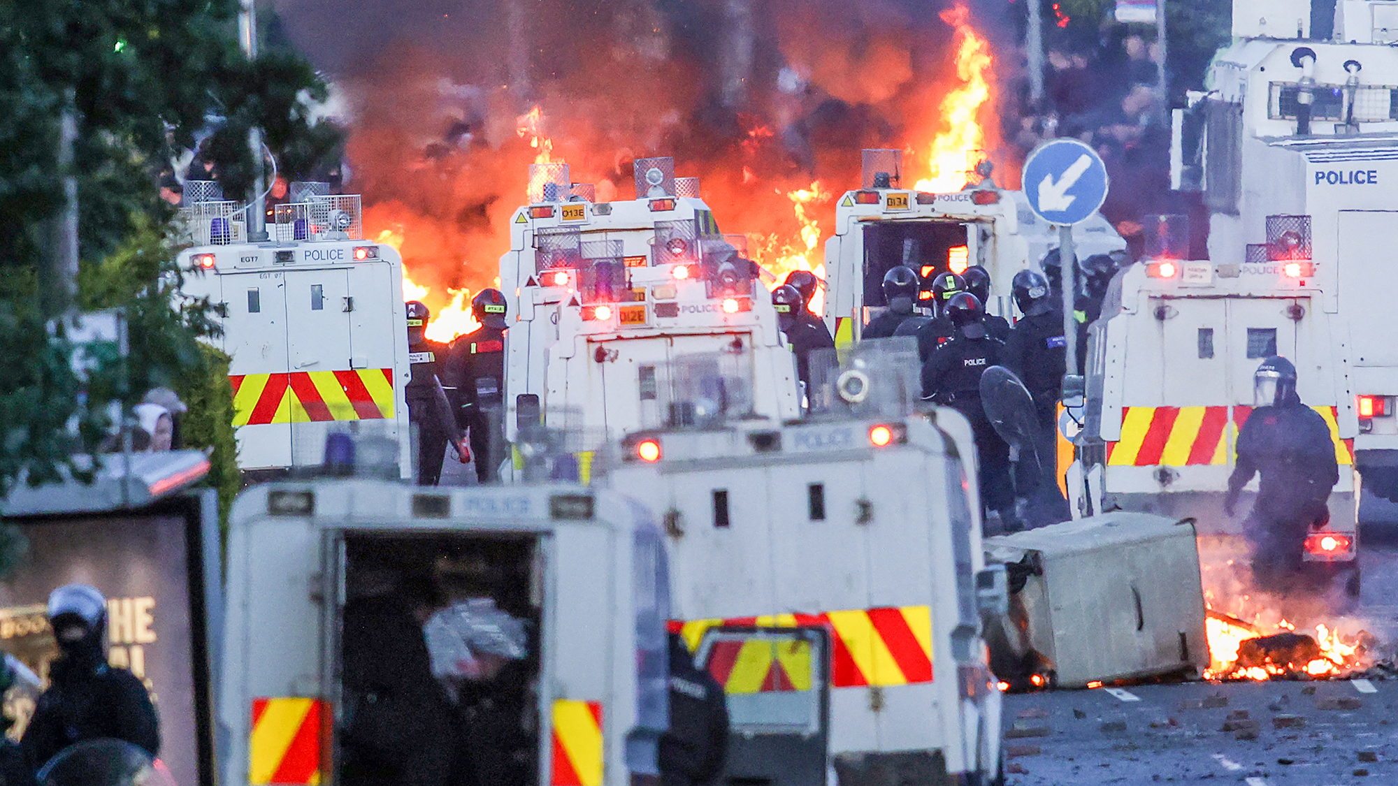 Fires rage as anti-immigration protesters stand off with police in Glengormley near Belfast, Northern Ireland