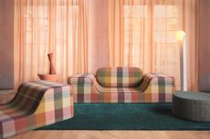 a modern sofa with a multicolor checkered fabric with peach color voiles
