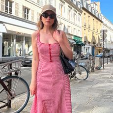 Fashion editor wearing a Doen dress in Paris