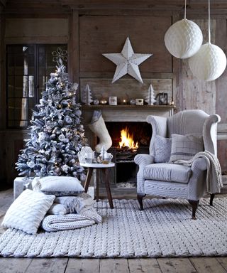 Alternative Christmas tree ideas with frozen effect branches and silvery decorations