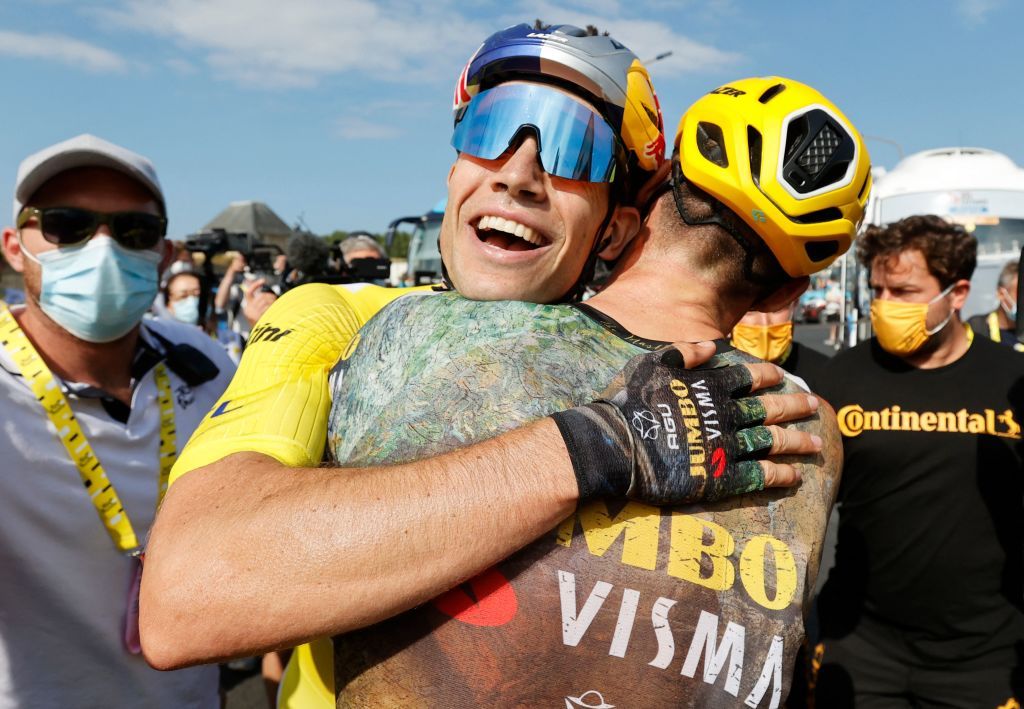 JumboVisma teams Belgian rider Wout Van Aert celebrates with teammates after winning the 4th stage of the 109th edition of the Tour de France cycling race 1715 km between Dunkirk and Calais in northern France on July 5 2022 Photo by Guillaume Horcajuelo various sources AFP Photo by GUILLAUME HORCAJUELOAFP via Getty Images