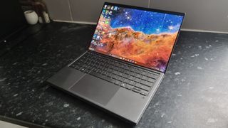 An Asus Zenbook Duo laptop on a kitchen counter