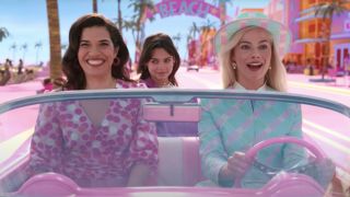 Margot Robbie and America Ferrera driving Barbie Car in Barbie Land from the Barbie movie 