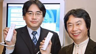 Former Nintendo President Satoru Iwata (L) and the company's game creator Shigeru Miyamoto, at a "Wii" press conference in Tokyo December 2006