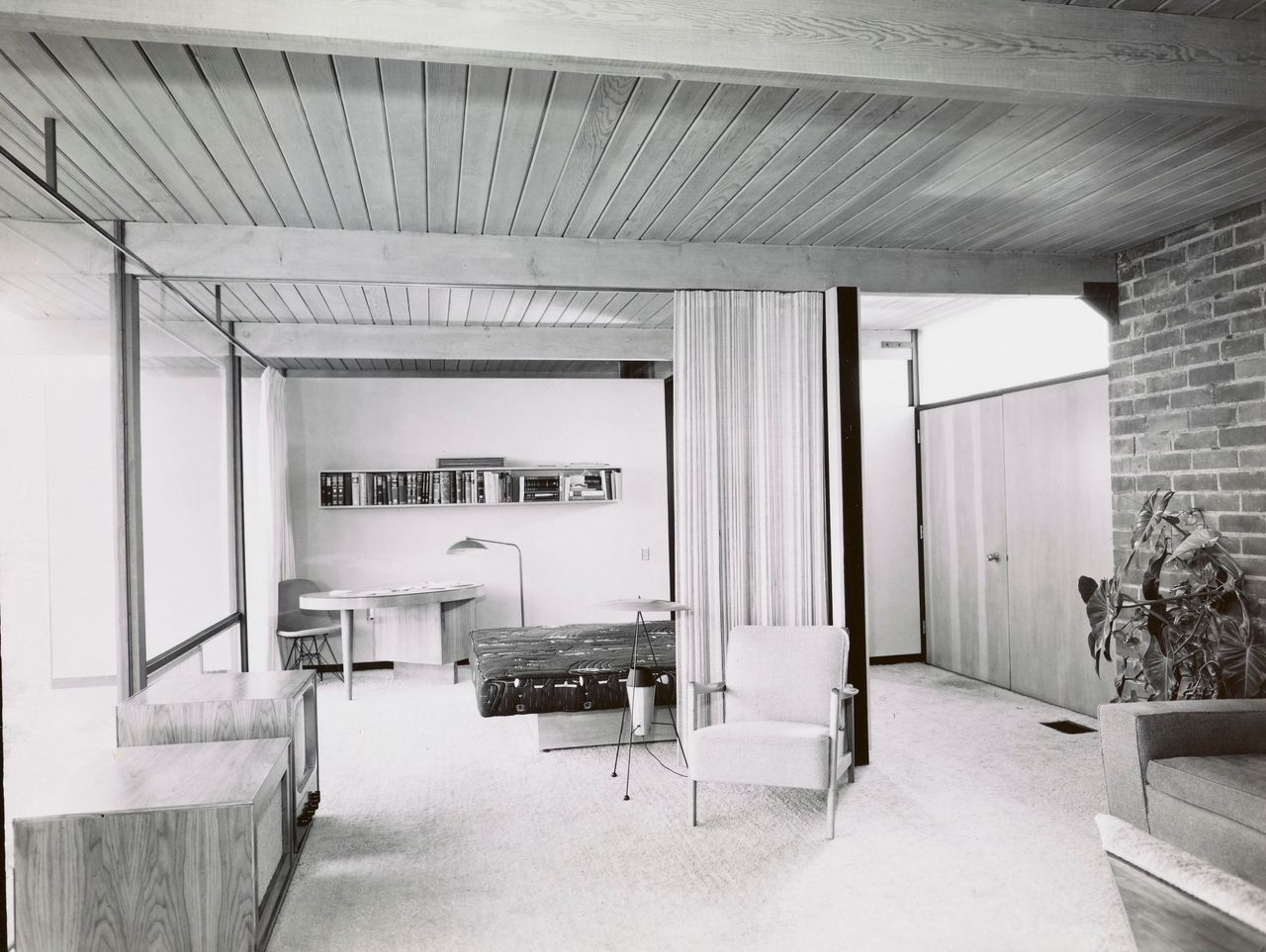 Modernist 1960s interiors of the homes in Crestwood hills. lots of glass, few walls, exposed brick