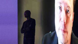 Microsoft Chairman and Chief Executive Officer Satya Nadella (L) is silhouetted as a pre-recorded interview with Elon Musk is played after announcing that Grok AI, by Musk's artificial intelligence start up xAI, will be available on Microsoft's Foundry Models, during the Microsoft Build conference opening keynote in Seattle, Washington on May 19, 2025. (Photo by Jason Redmond / AFP) (Photo by JASON REDMOND/AFP via Getty Images) 