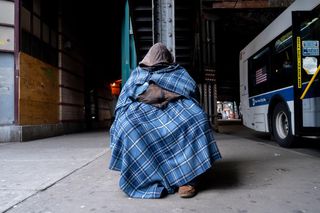 Joe, bundled up under the Woodside Subway Station at 61st Street in Queens, NY