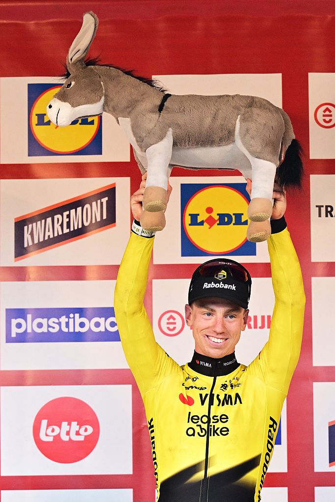 Great Britain's Matthew Brennan of Team Visma-Lease a Bike celebrates on the podium after winning the 78th edition of the men elite race of the Kuurne-Brussels-Kuurne one day cycling race, 195 km from Kuurne to Kuurne via Brussels, Sunday 01 March 2026. BELGA PHOTO DIRK WAEM (Photo by DIRK WAEM / BELGA MAG / Belga via AFP)