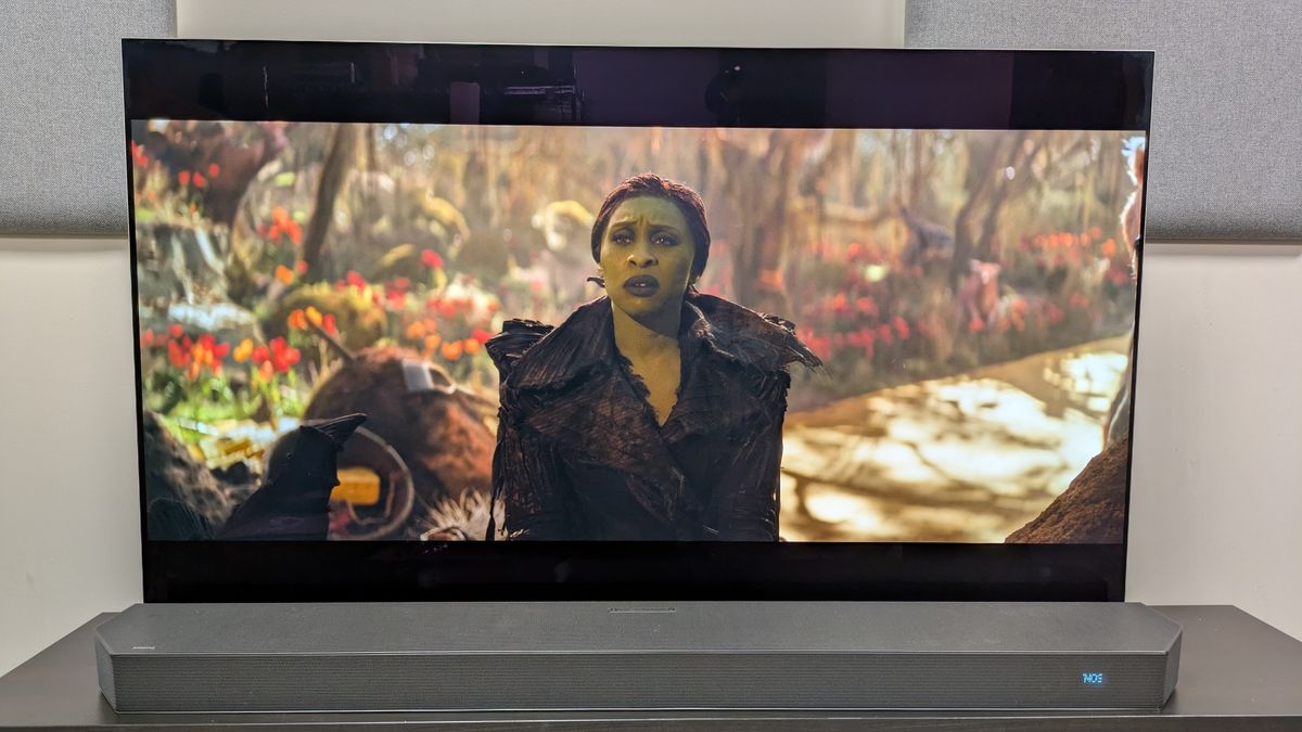 Wicked: For Good 4K Blu-ray on LG G5 OLED showing Elphaba staring while sat in the woods.