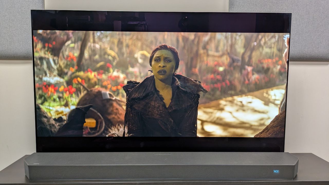 Wicked: For Good 4K Blu-ray on LG G5 OLED showing Elphaba staring while sat in the woods.