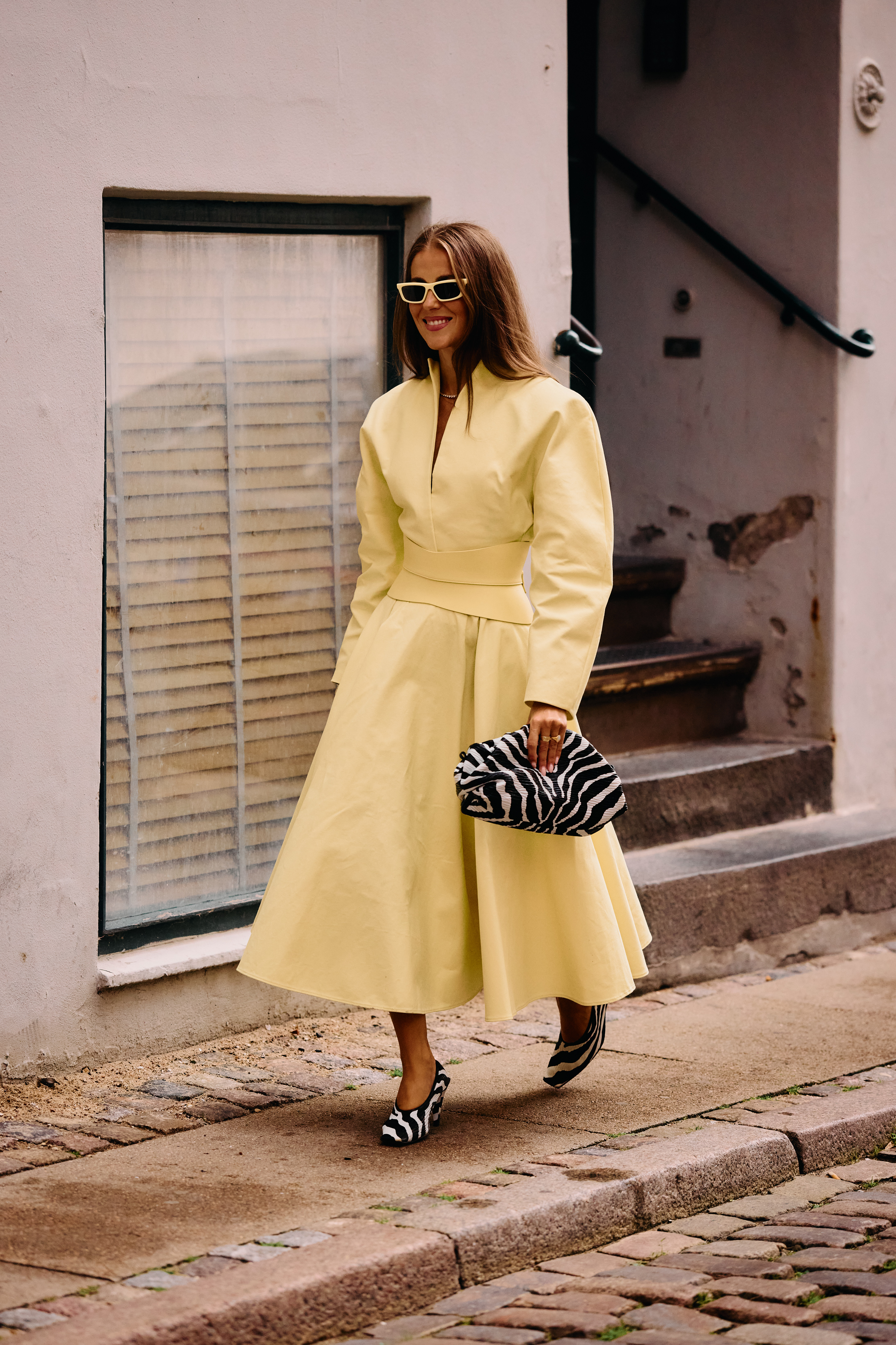 Copenhagen Fashion Week attendees wear animal print shoes.