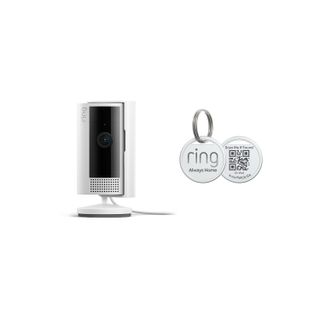 Ring indoor camera and pet tag against white background.