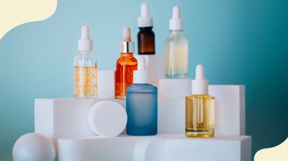 a shot of a collection of skincare serums, to llustrate the niacinamide vs hyaluronic acid debate