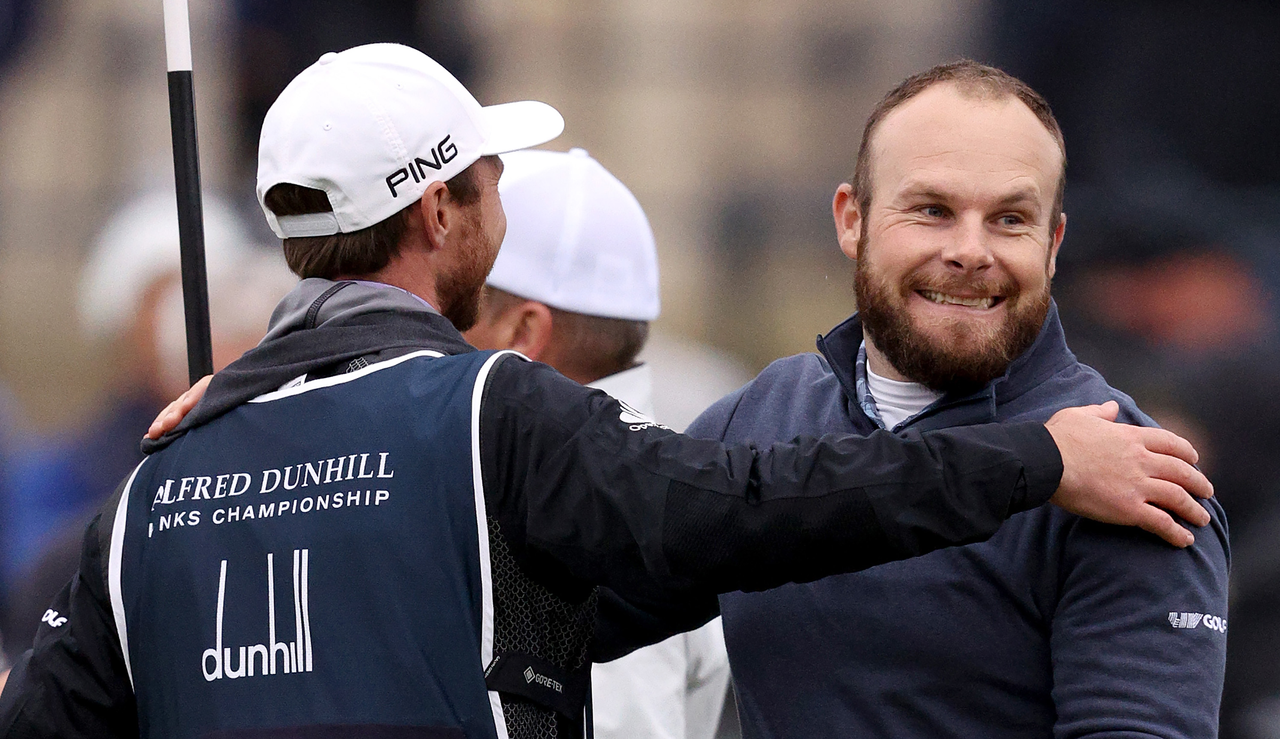 Tyrrell Hatton hugs his caddie after winning the Alfred Dunhill Links Championship