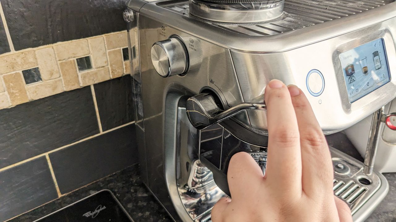 Sage Barista Touch Impress side lever being pressed