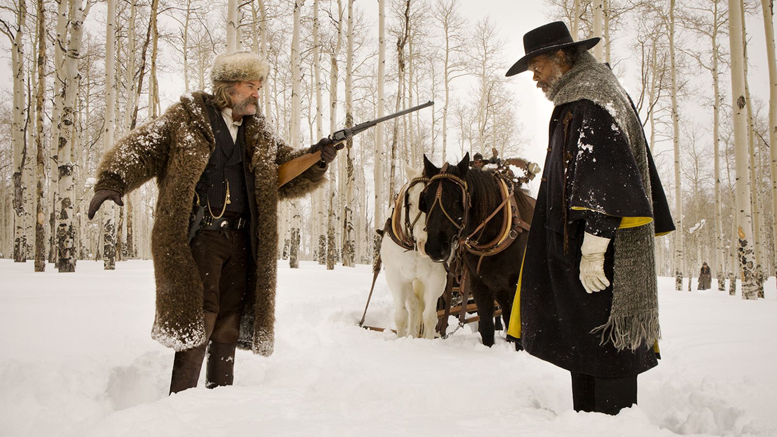 John Ruth holds Major Marquis Warren at gunpoint in The Hateful Eight